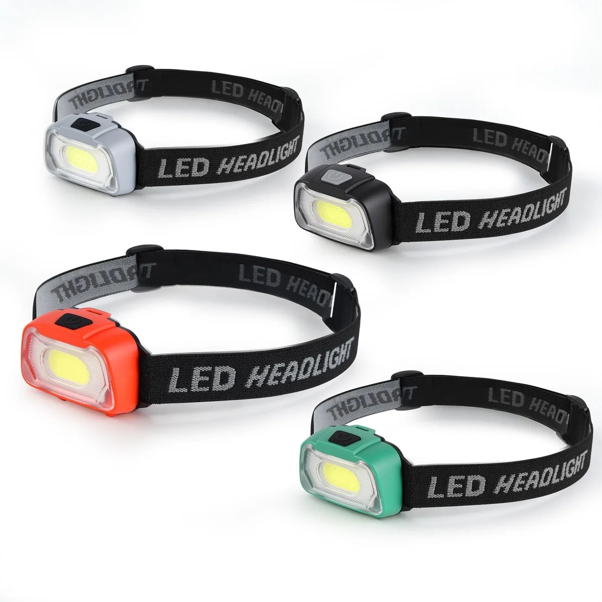 Four compact black headlamps with adjustable straps and COB lenses side by side