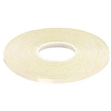White double-sided foam tape roll on a liner, continuous strip, vinyl foam material