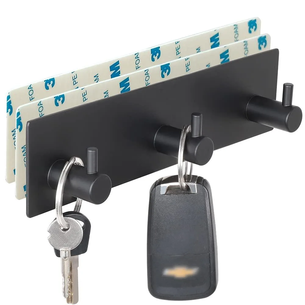 Black stainless steel wall hook rack with three hooks and adhesive strips
