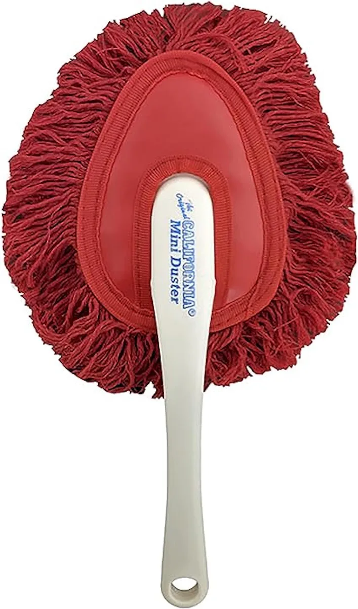 Compact wax-treated cotton duster with plastic handle