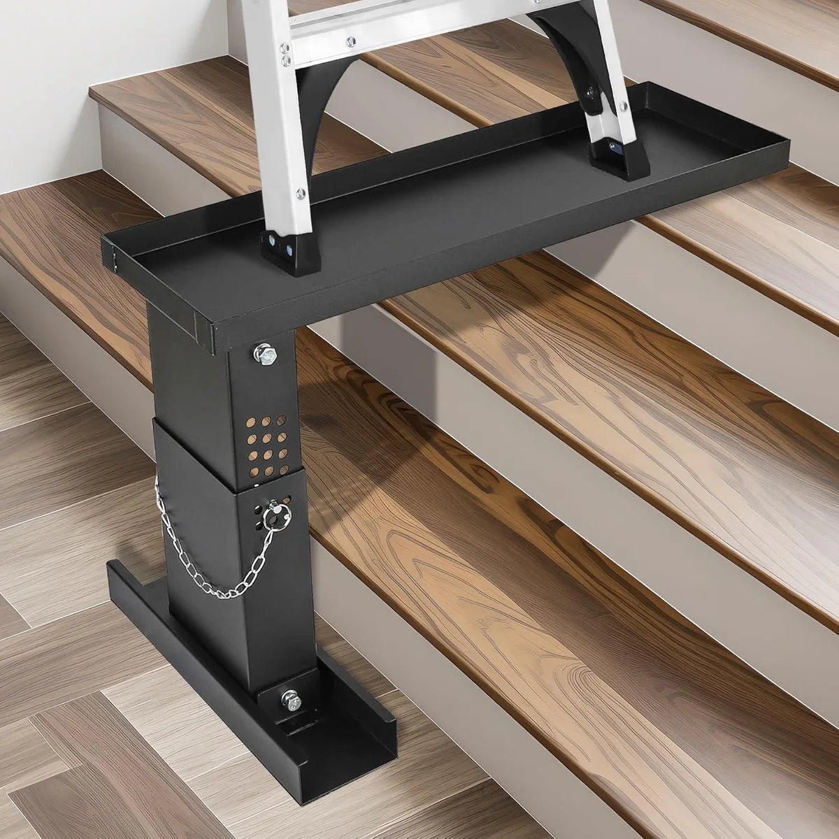 Silver steel ladder stabilizer with adjustable arms and non-slip feet
