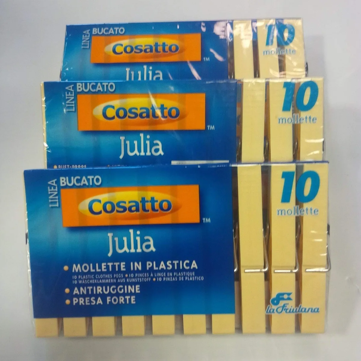 Thirty beige plastic clothespins with metal springs in a pack
