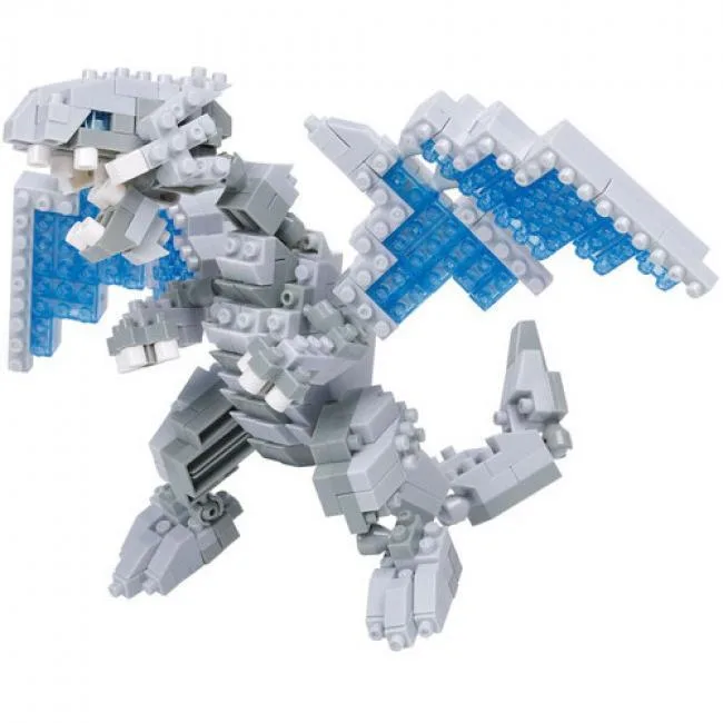 Small white dragon model with movable wings and head built from tiny bricks in a box