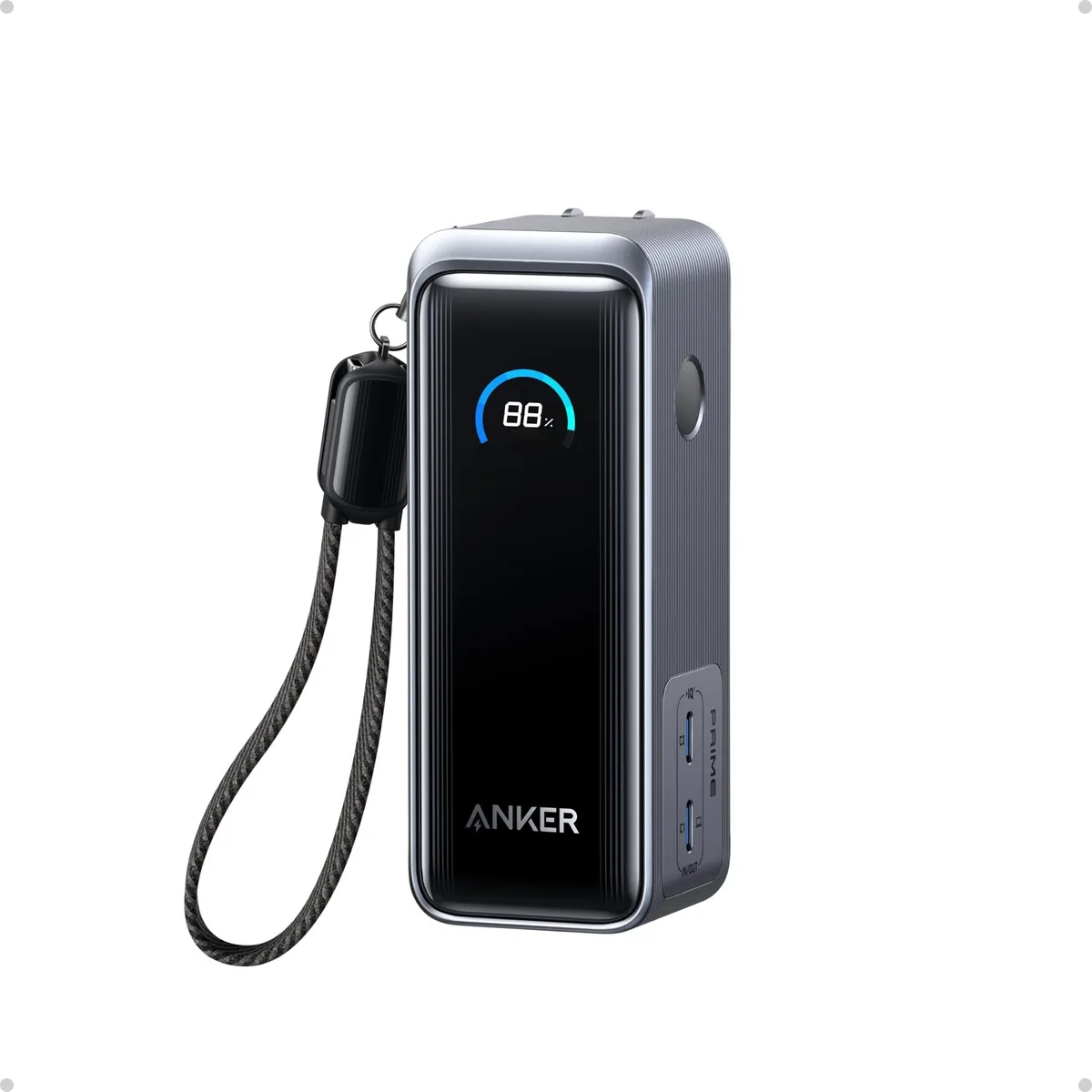 Black rectangular power bank with LCD screen and USB-C ports