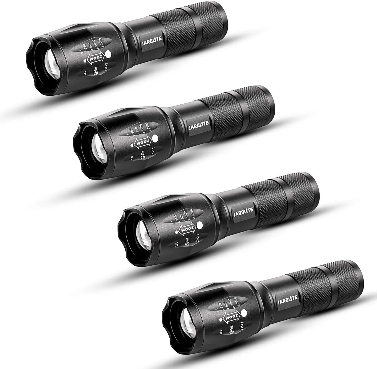 Four black cylindrical flashlights with adjustable focus bezels lying side by side