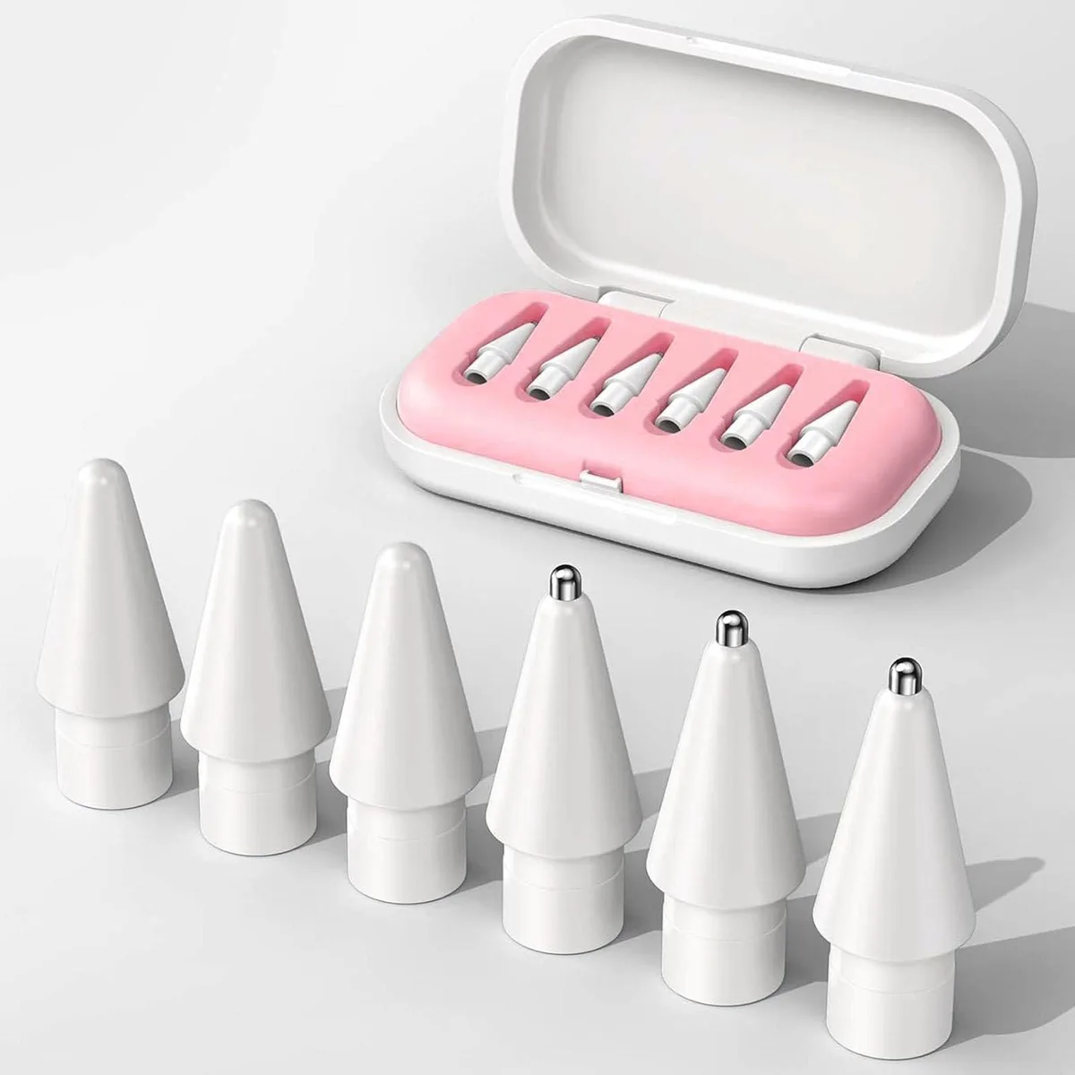 Six replacement Apple Pencil tips in a pink storage case
