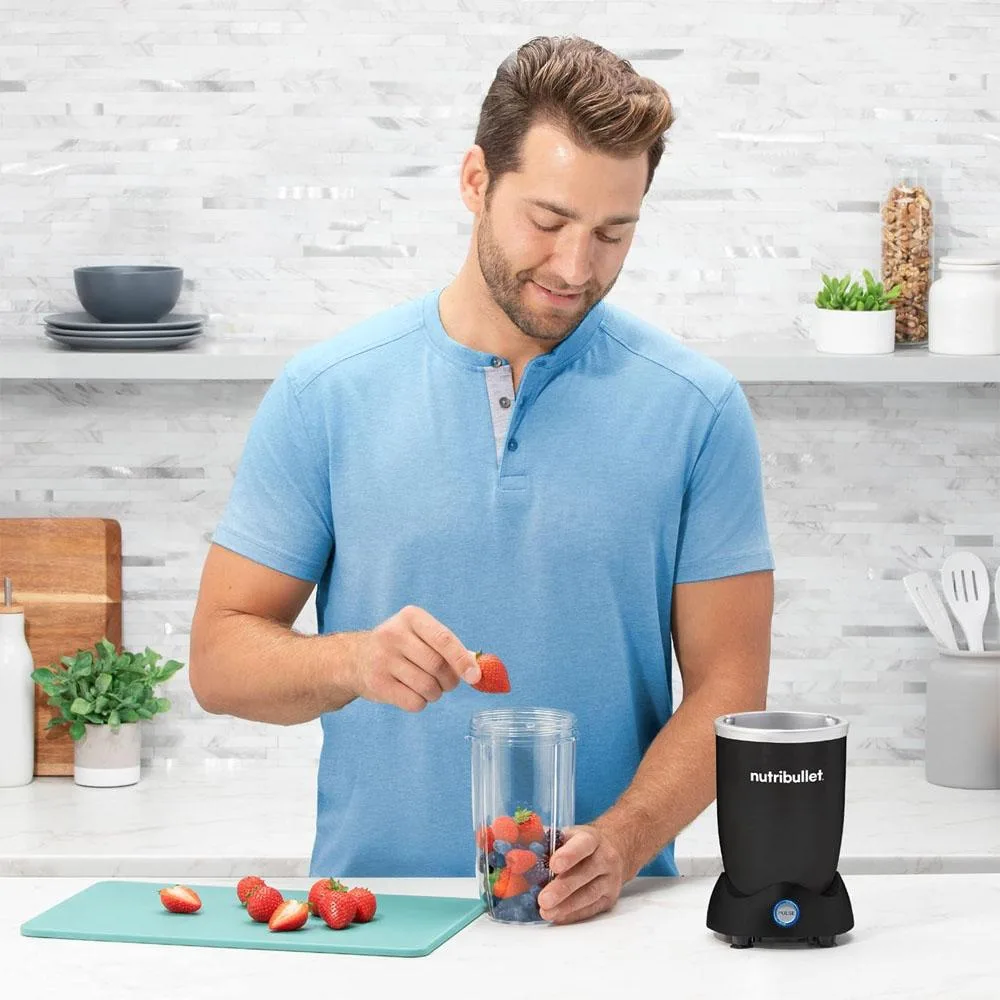 Silver personal blender with 1200W motor base, blending cup and to-go lid