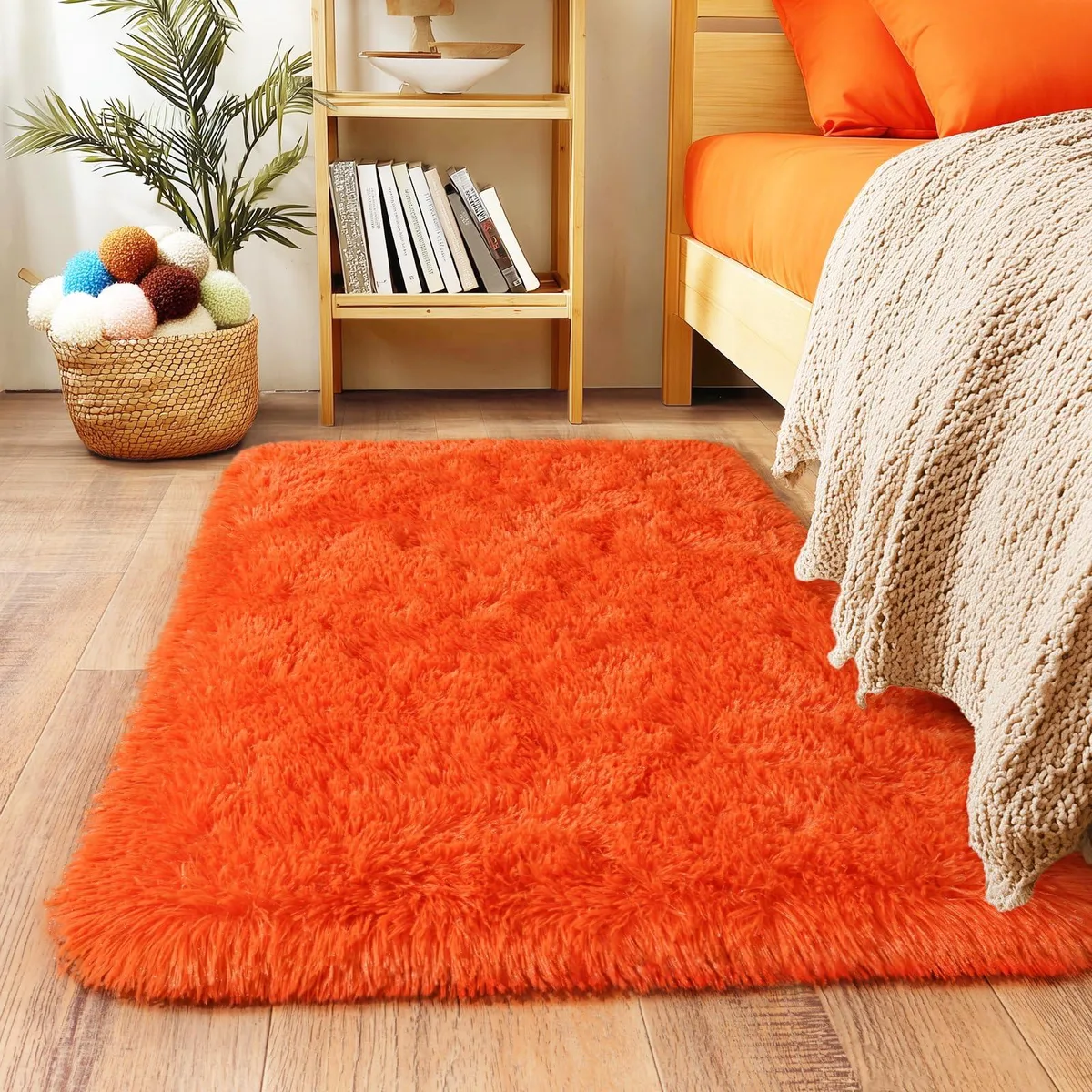 Bright orange rectangular rug with thick fluffy pile, 2 by 3 feet