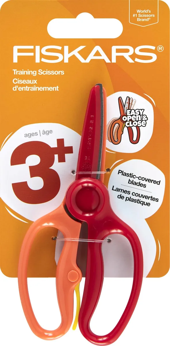 Red plastic-covered safety scissors with training lever and blunt tips
