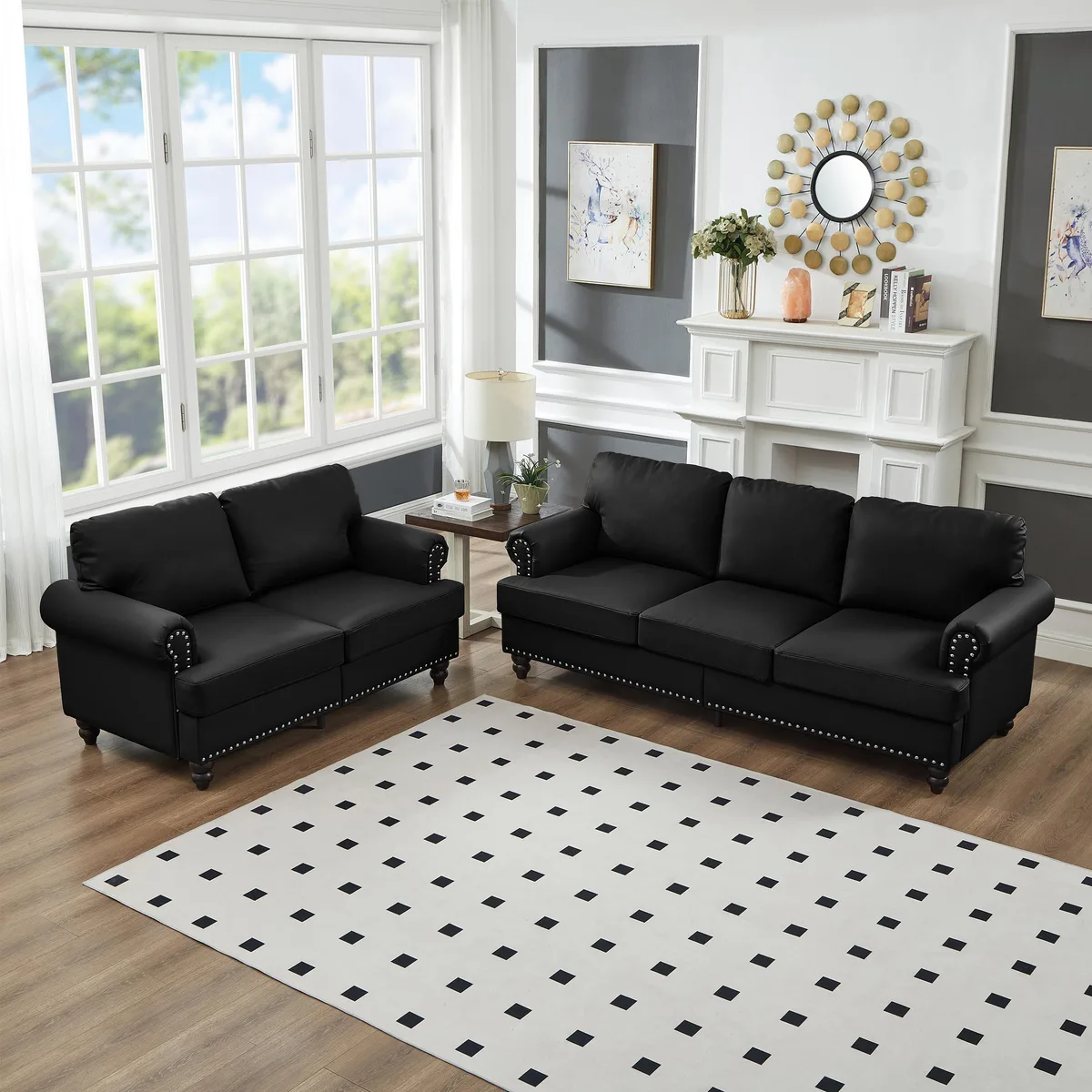 Black leather two-piece sofa set with nailhead trim and storage under seat cushions