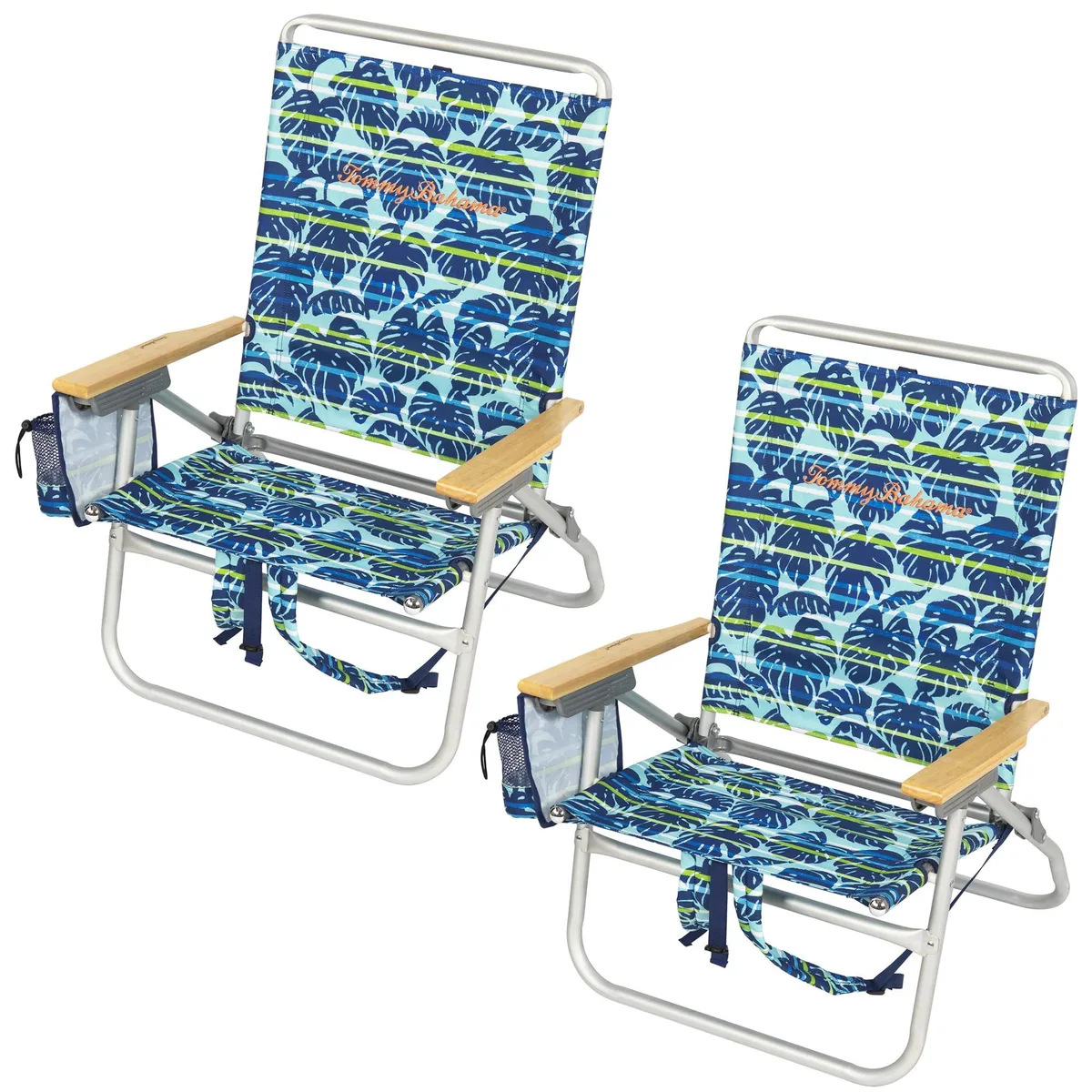 Two folded backpack beach chairs with blue tropical leaf print polyester seats and wooden armrests