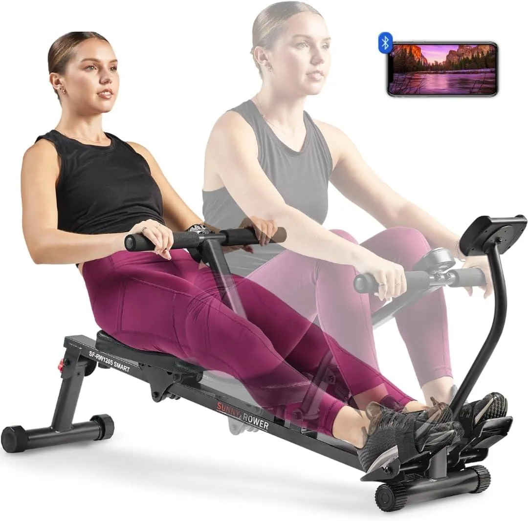Compact silver rowing machine with hydraulic cylinder, digital display and phone holder