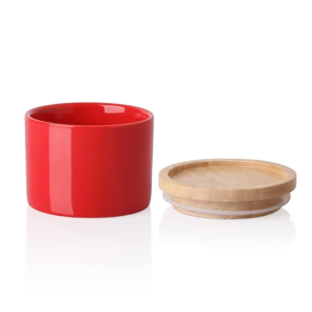 Small red ceramic jar with wooden lid, 3.3 by 2.6 inches