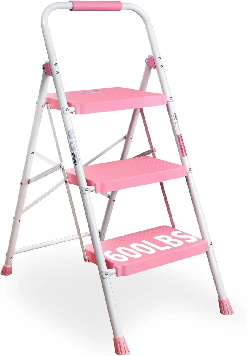 Pink three-step folding steel ladder with wide anti-slip pedals and handgrip