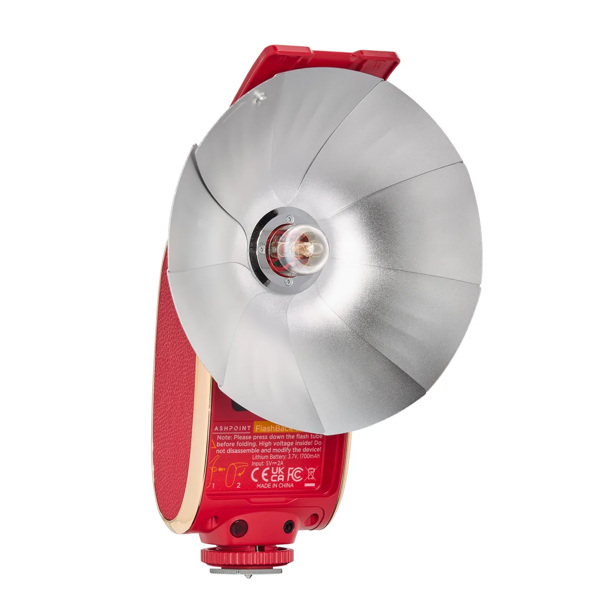 Compact red clam-shell flash opens to full-size unit with retro fan reflector