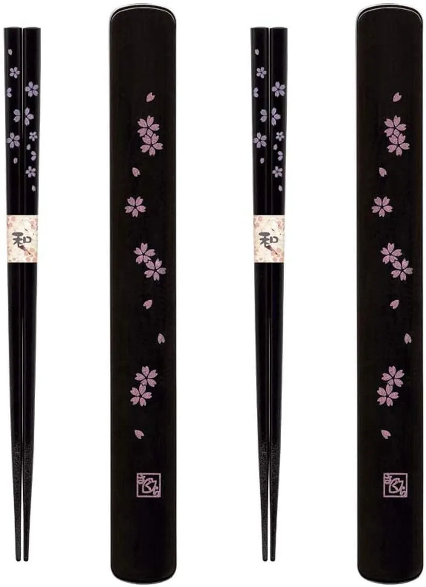 Two pairs of silver bamboo chopsticks with floral handles and black plastic travel cases