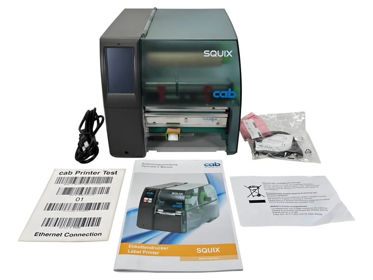 Rectangular thermal label printer in grey and black, peel rewind module visible