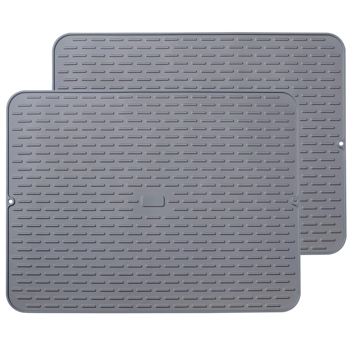 Two large rectangular silicone mats with raised ridges, light grey finish, folded and rolled
