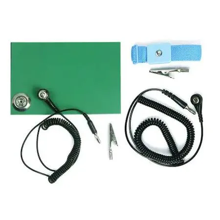 Blue rectangular static control mat with coiled wrist strap cord and alligator clip on grey surface