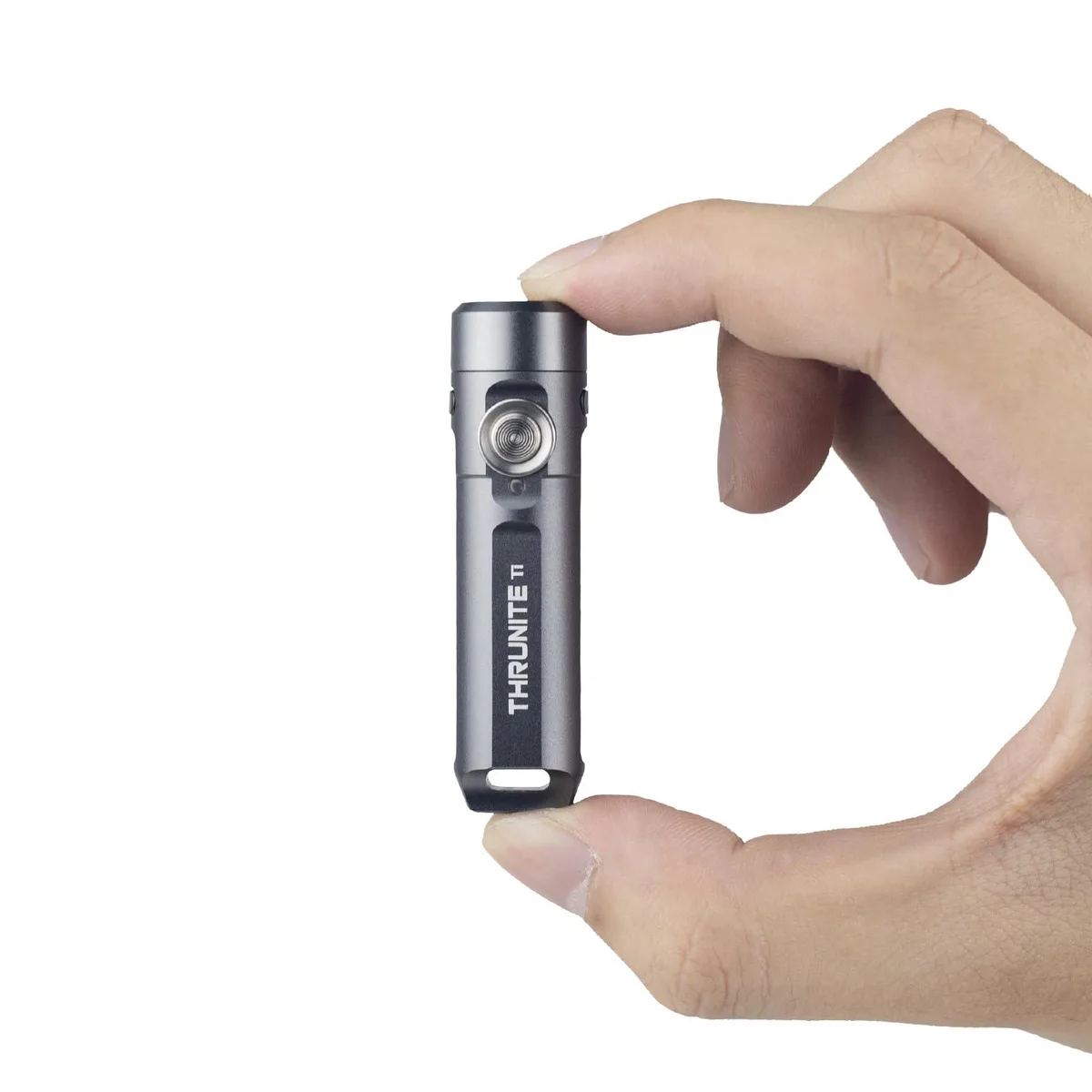 Small grey aluminium keychain flashlight with USB-C port and magnetic tailcap