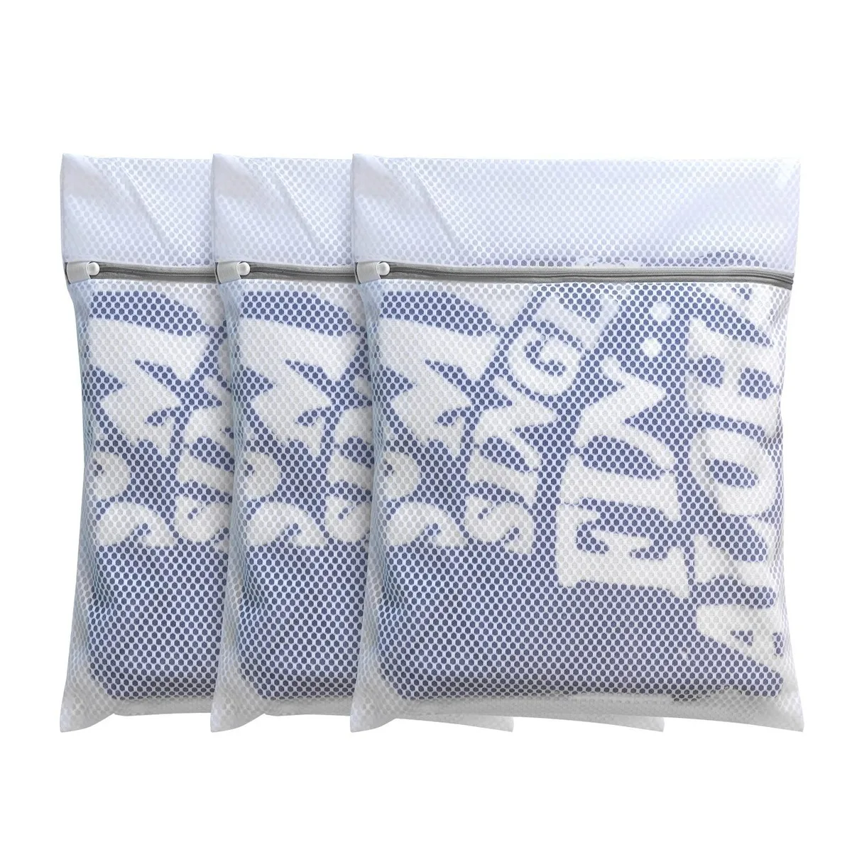 Three white honeycomb mesh laundry bags with zippers lying flat