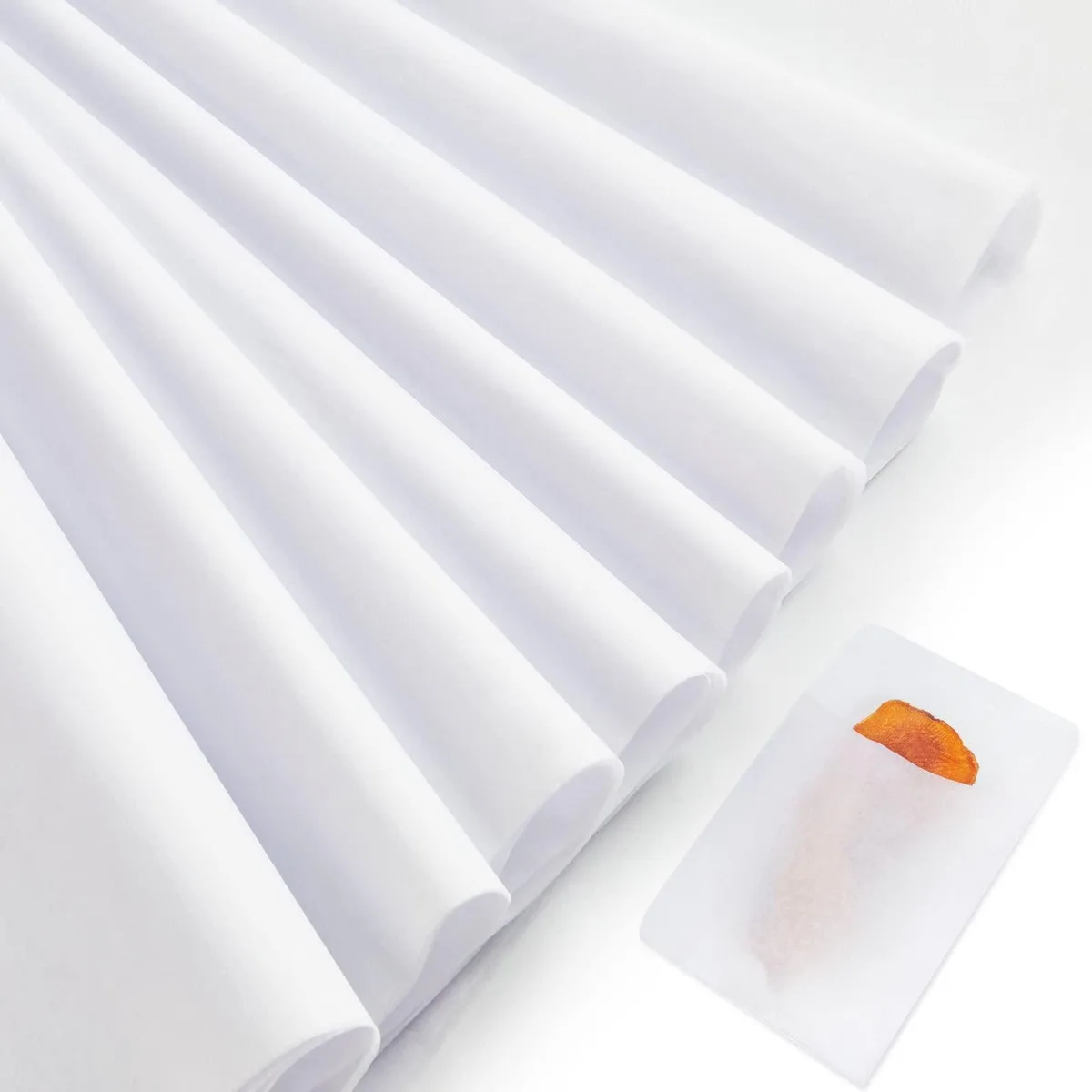 Stack of 100 white archival tissue sheets 20 by 30 inches
