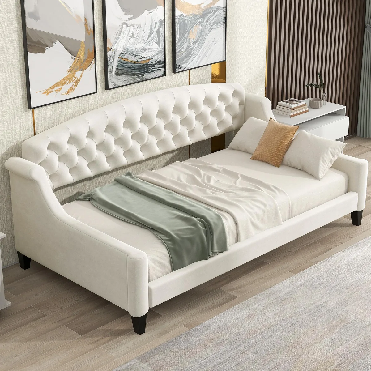 Beige upholstered twin daybed with tufted buttons and wooden slat frame
