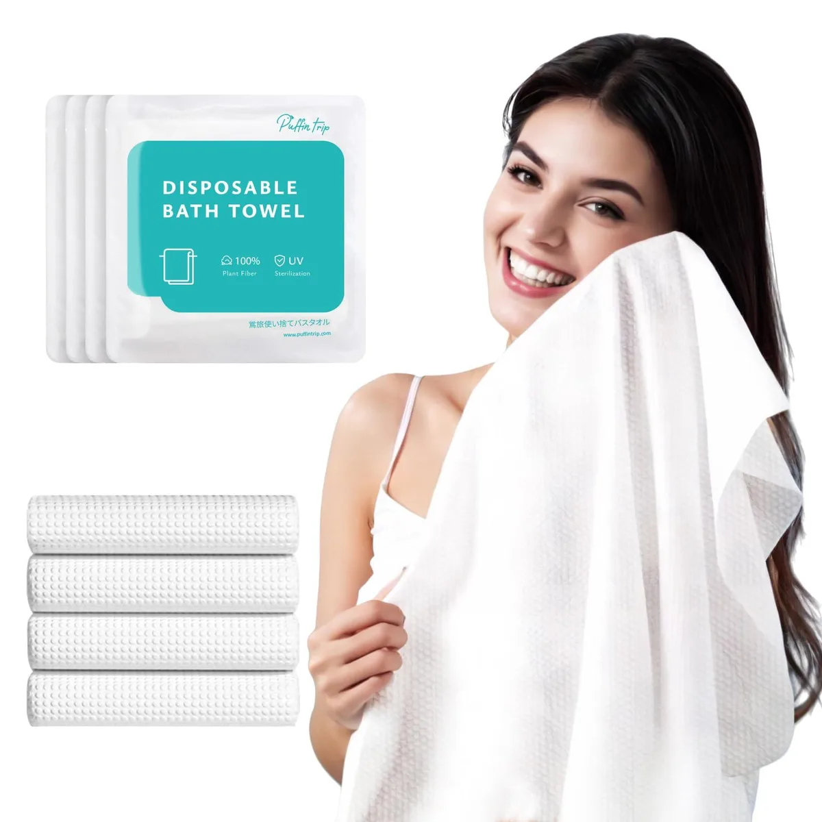 Four white compressed bath towels in individual vacuum packs