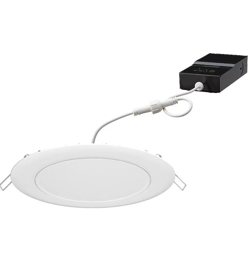 A matte-white round recessed downlight with a slim canless profile