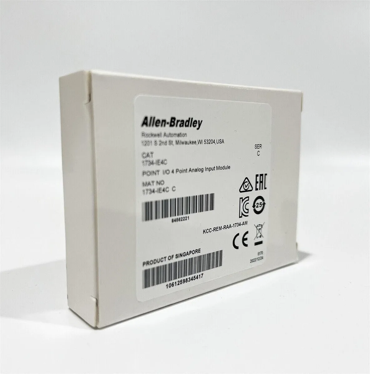 Compact rectangular industrial module with green terminal block and side latch