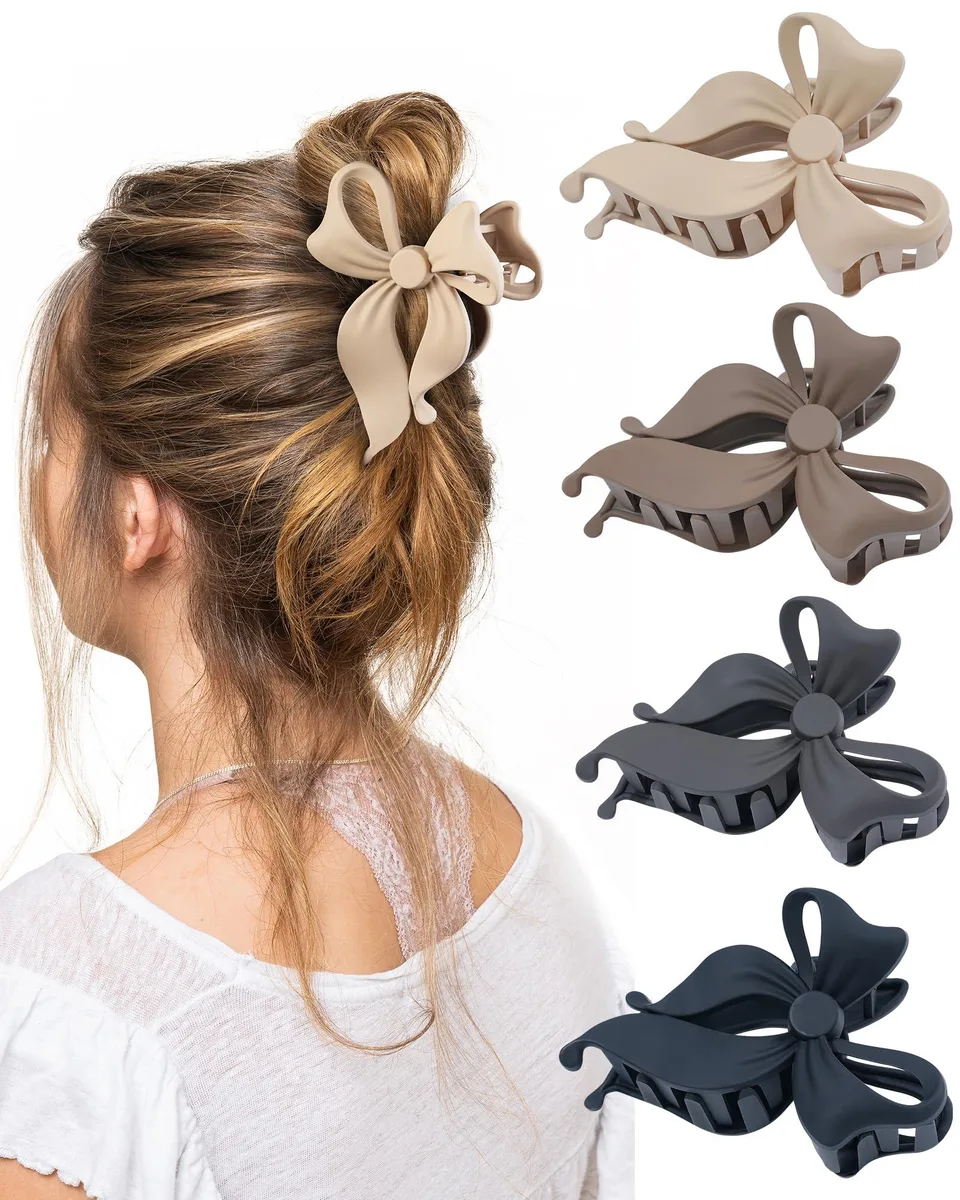 Four large plastic bow claw clips in different colours, 10.5 cm each