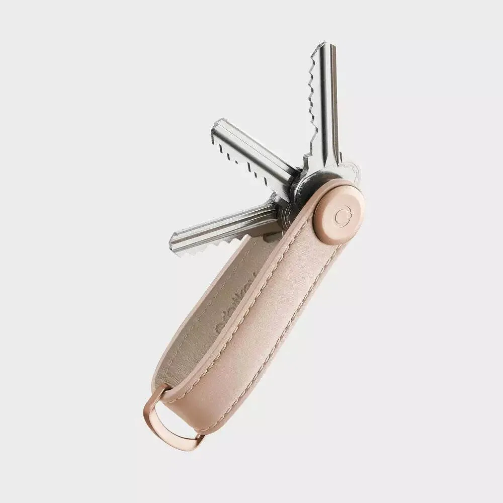 Blush leather key organiser with matching stitching and D-ring, holds two to seven keys
