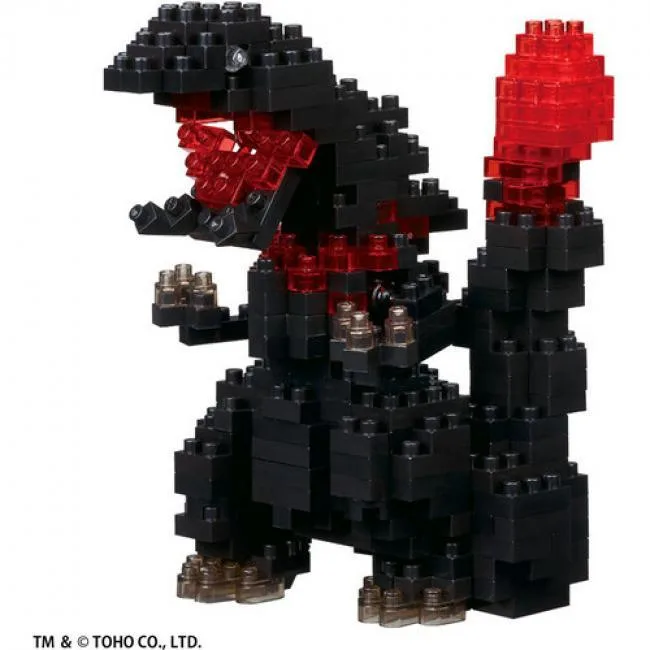 Small boxed set of tiny bricks forming a detailed Godzilla figure on a clear display plate