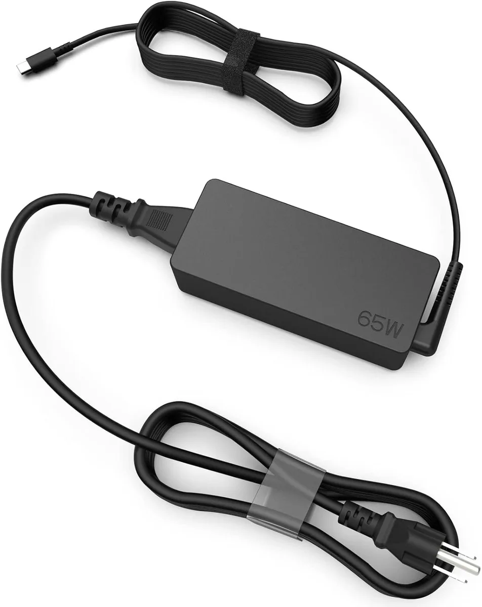 A compact black USB-C laptop charger with a detachable power cord