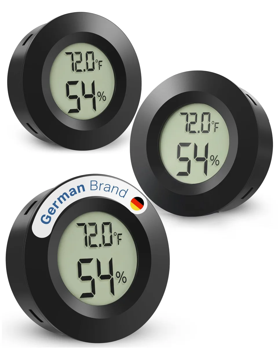 Three small black rectangular digital hygrometer-thermometers with LCD screens