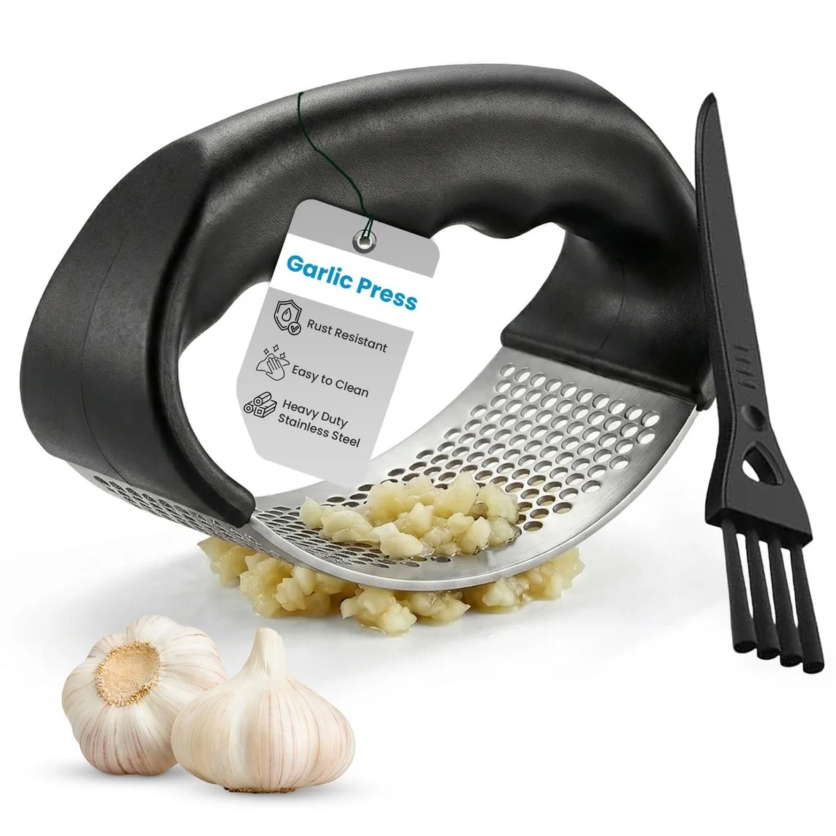 Stainless steel garlic press with curved handles and a small cleaning brush beside it
