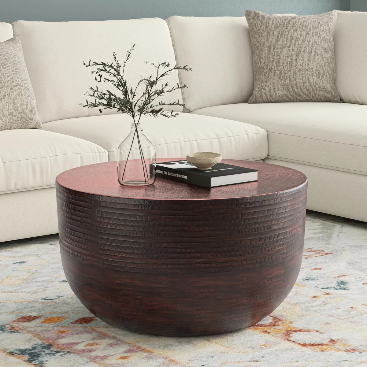 Round oil-rubbed bronze metal coffee table with textured surface