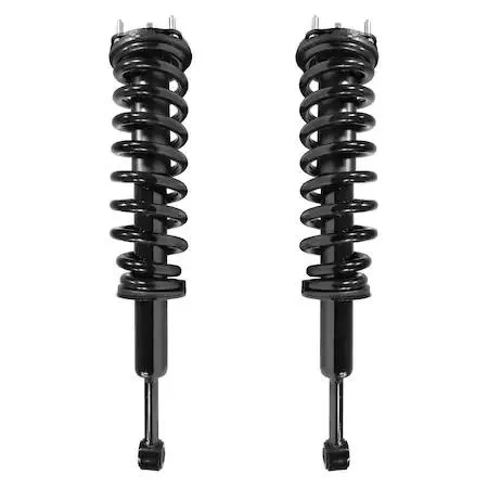 Two silver front strut assemblies with coil springs and top mounts, new condition
