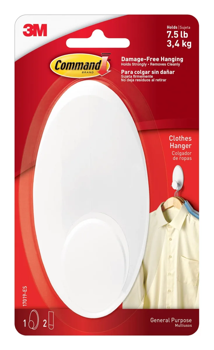 A single white plastic hook with two large adhesive strips on a backing card