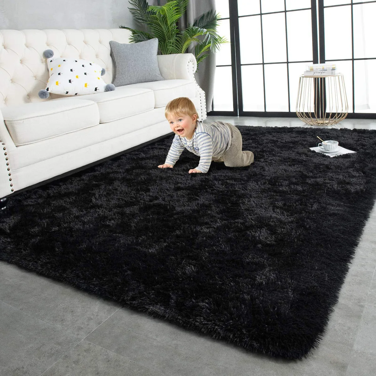 Black rectangular shaggy rug with fluffy pile and anti-slip backing