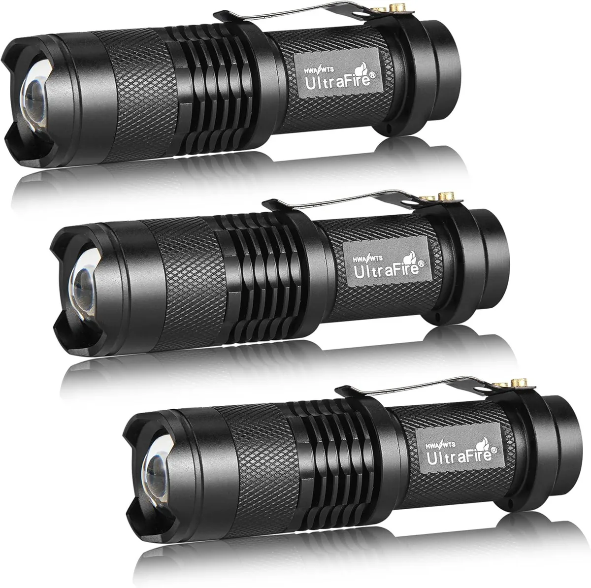 Three compact aluminium flashlights with textured grip and adjustable focus rings