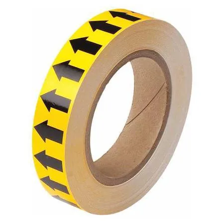 Yellow pipe marking tape roll with directional arrows on glossy vinyl finish