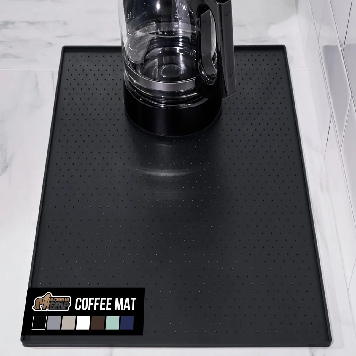 Black rectangular silicone mat with raised edges and textured surface measuring 11.5 by 18.5 inches