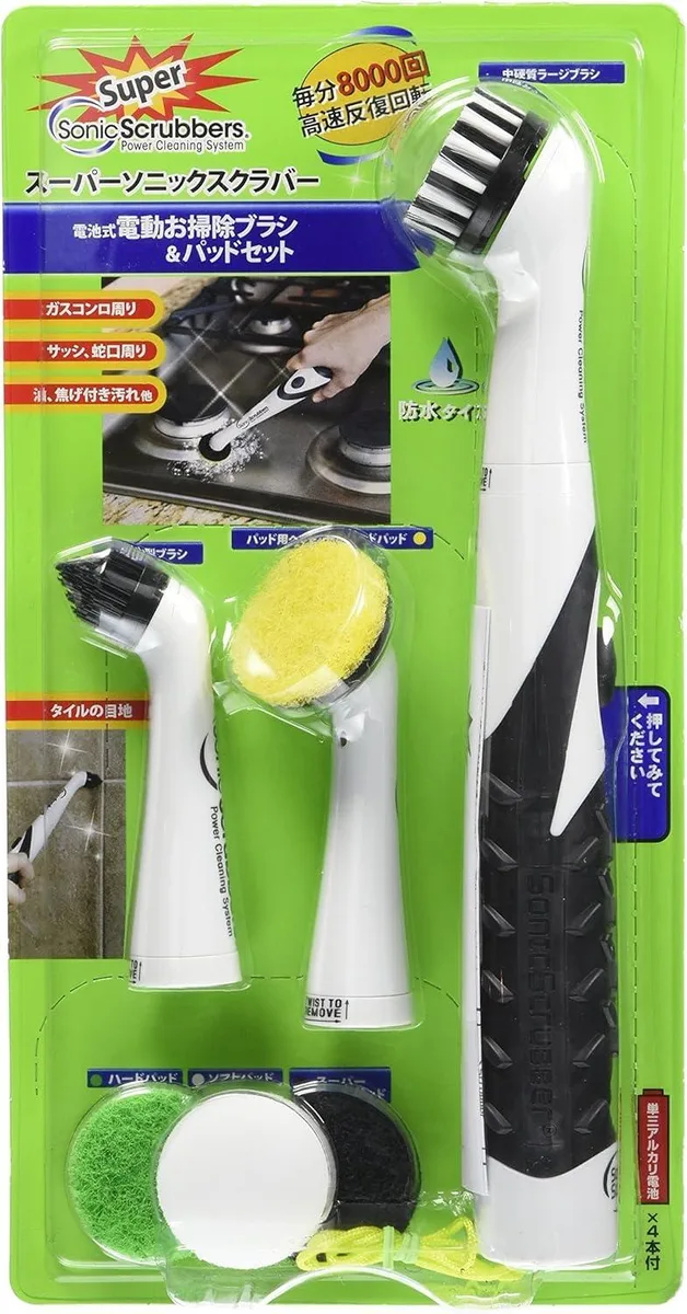 White handheld electric brush with interchangeable heads and pads