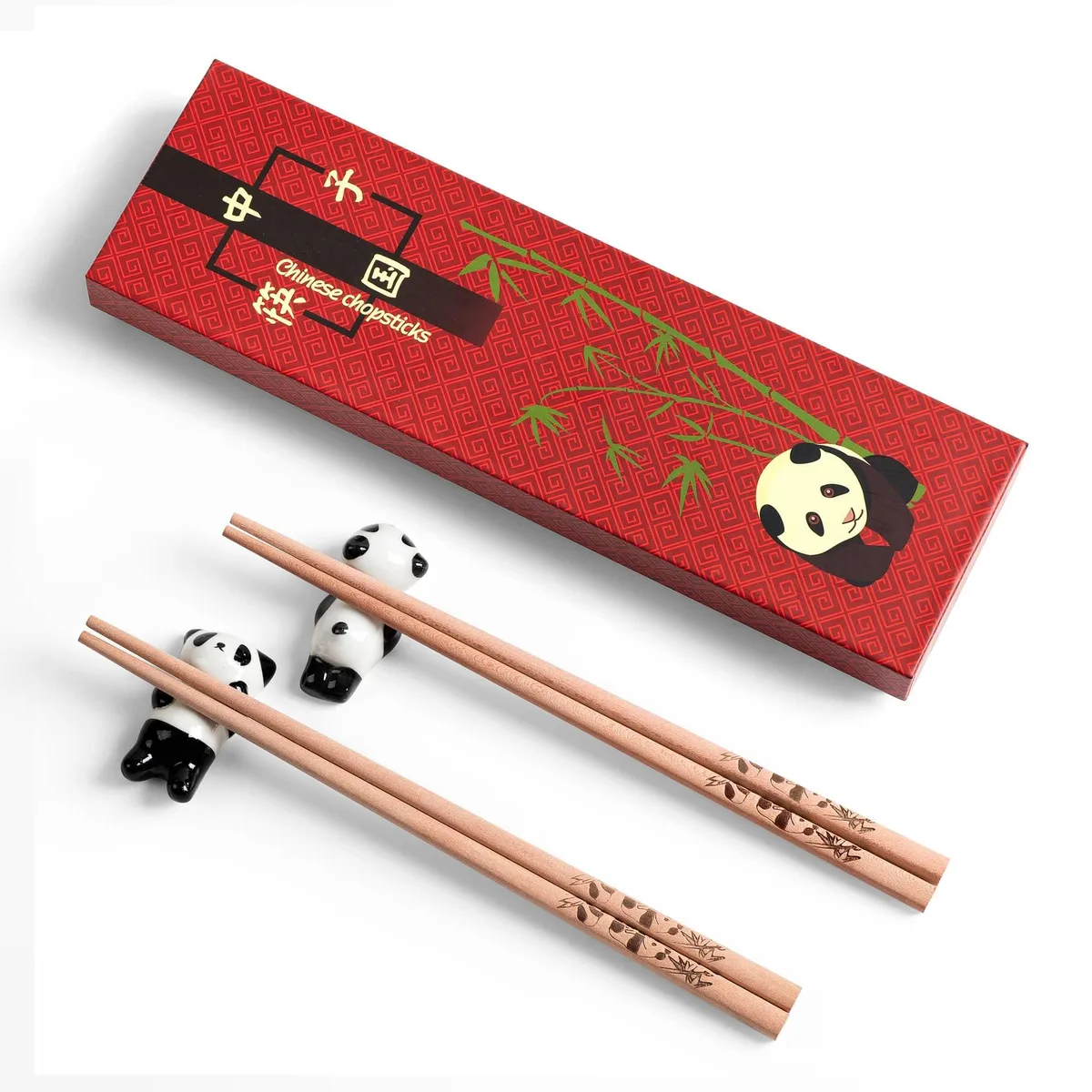 Two pairs of mahogany chopsticks with panda engravings and matching rests
