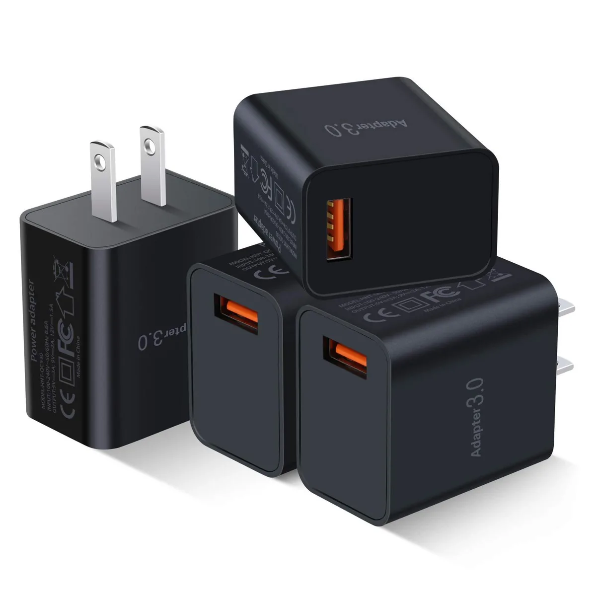 Four compact white USB wall chargers with single ports arranged side by side
