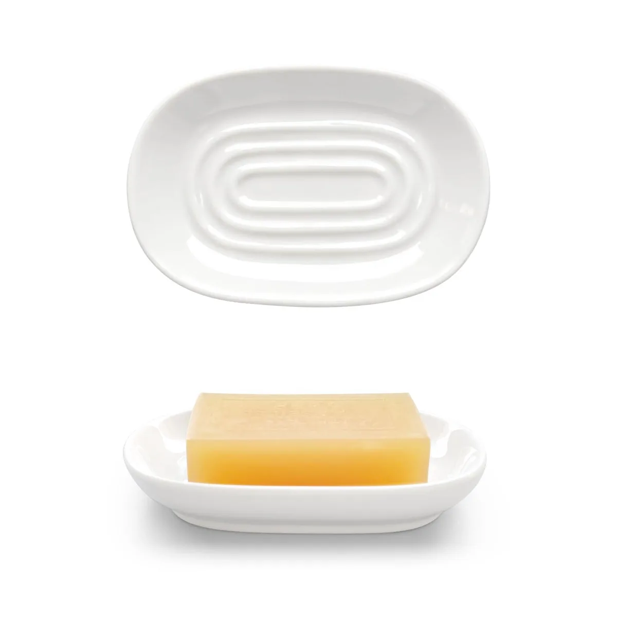 White oval ceramic soap dish with glazed finish and ridged interior