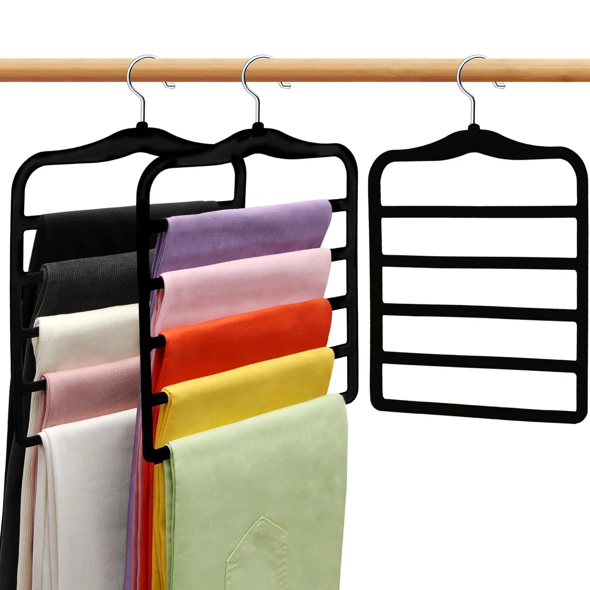 Three black velvet five-tier trouser hangers with rotating chrome hooks