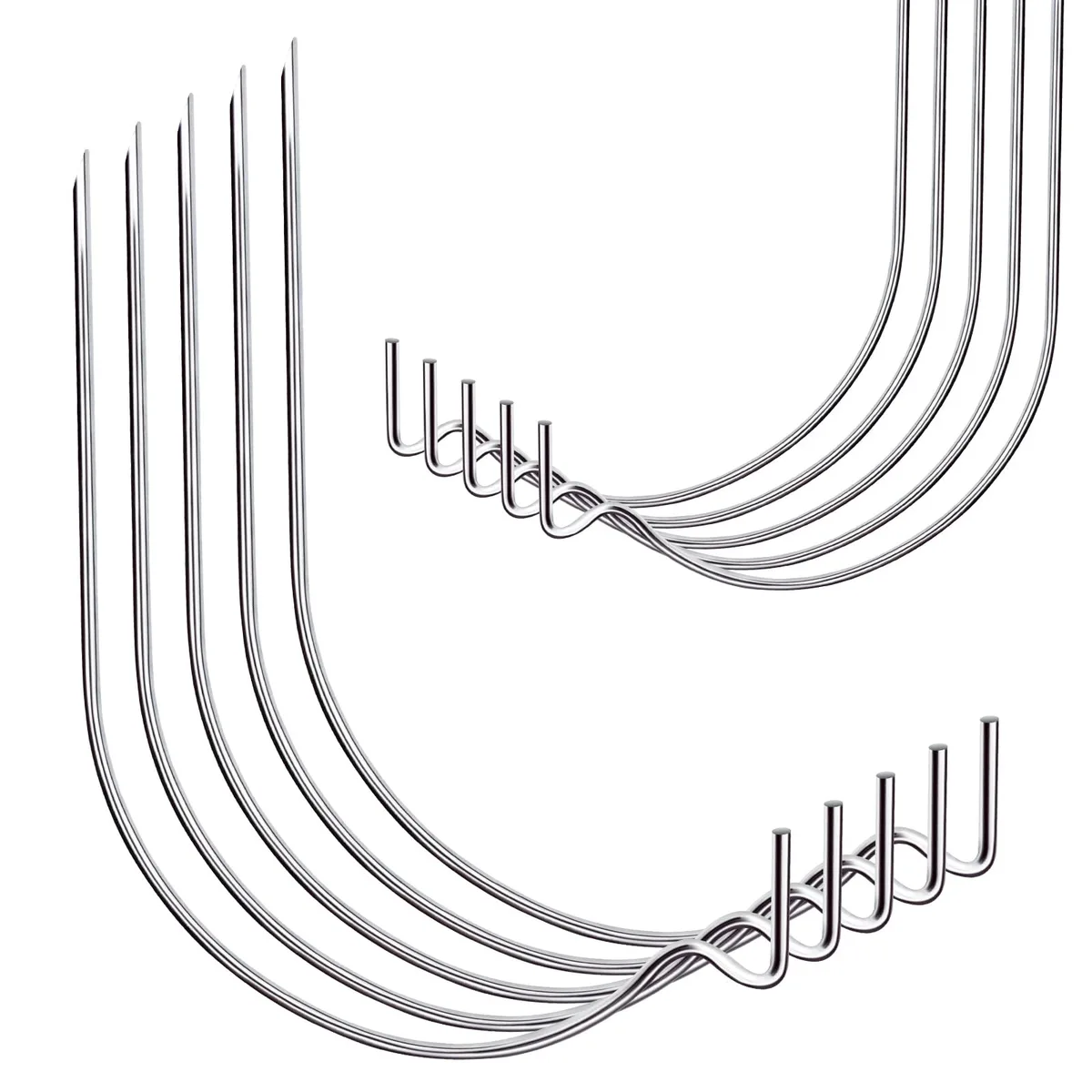 Twenty silver steel picture hooks on a light background