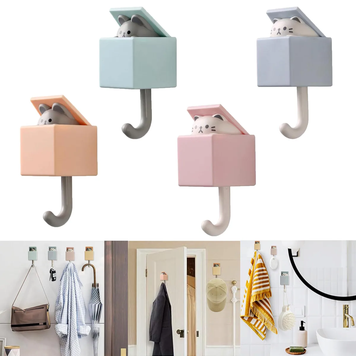 Four white adhesive cat hooks, each with a pop-up kitten head, on a smooth surface